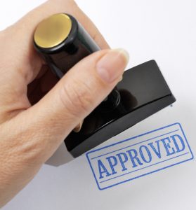 Rubber stamp in a hand