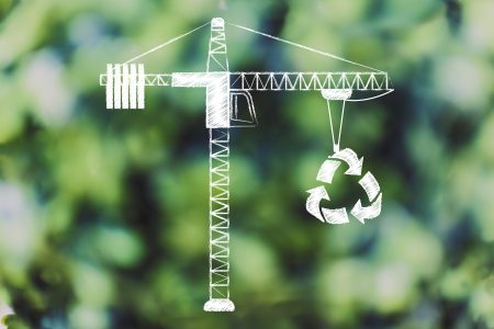 tower crane lifting up a recycle symbol, concept of sustainable development